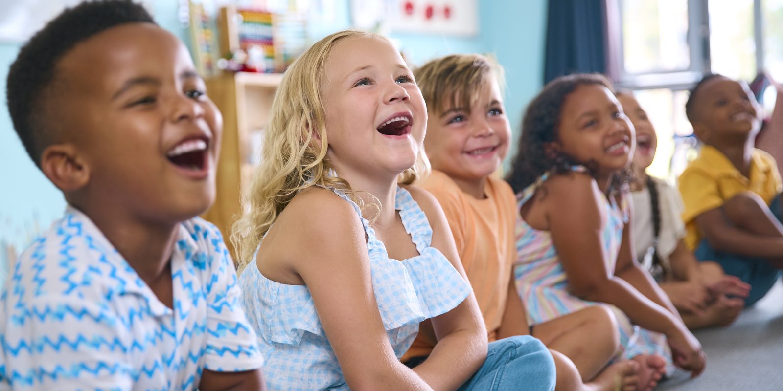 Happy kids laughing together in FAITH kids ministry